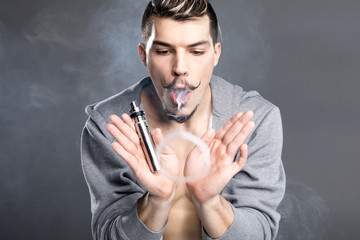 Young man vaping