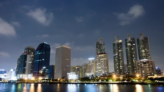 time lapse of city downtown with reflection of skyline in Bangkok,Thailand