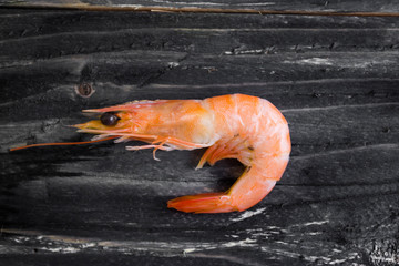 Shrimps on a wooden table in rustic style