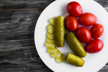 Pickled vegetables on a wooden table in rustic style