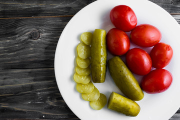 Pickled vegetables on a wooden table in rustic style