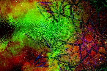 filigrane ornament with mandala shape on cosmic backgrond, computer collage and glass effect.