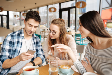 Friends using smartphones together