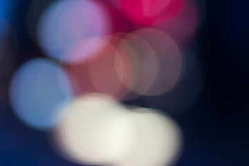 Blurred and defocused abstract background with soft multicolored bokeh circles, overlay concept.