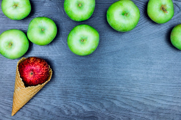 Healthy ice-cream. Healthy food: Apples in wafer cup isolated on grey  background