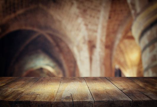 Table In Front Of Abstract Blurred Church Interior Background