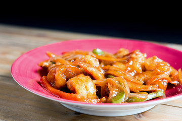 wok fried chicken stir fry with sweet peppers and chinese vegetables