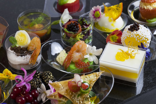 Mini canapes with elements of molecular cuisine on stone 