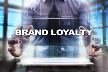Fototapeta na wymiar Businessman using tablet pc and selecting brand loyalty.