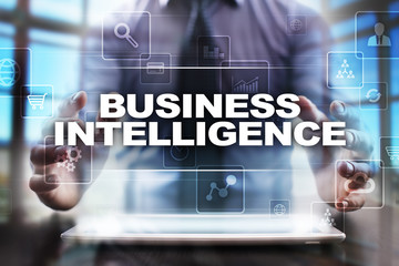 Fototapeta na wymiar Businessman using tablet pc and selecting business intelligence.