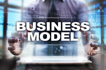 Fototapeta na wymiar Businessman using tablet pc and selecting business model.