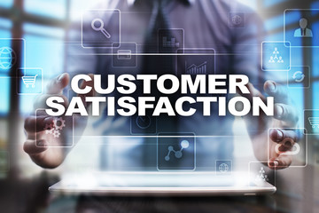 Fototapeta na wymiar Businessman using tablet pc and selecting customer satisfaction.