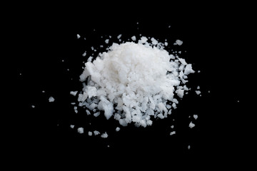 Obraz na płótnie Canvas pile of white sea salt isolated on black