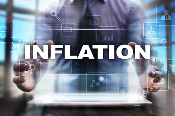 Businessman using tablet pc and selecting inflation.