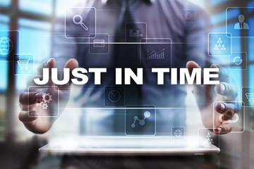 Businessman using tablet pc and selecting just in time.