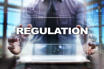 Businessman using tablet pc and selecting regulation.