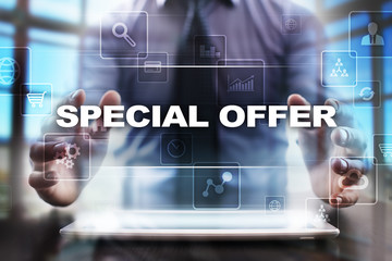 Businessman using tablet pc and selecting special offer.