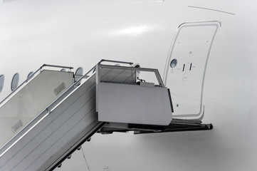 Ramp near entrance in passenger plane, mobile ladder in airport, aviation and aerospace industry, detail 
