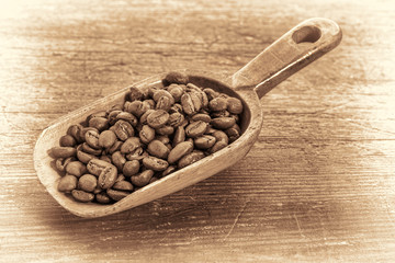 scoop of coffee beans in retro toning