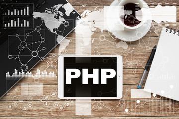 Tablet on desktop with php text.
