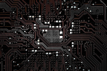 Closeup electronic circuit board background.