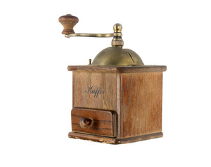 Very old antique coffee grinder with a bronze handle and box for ground coffee on a white...