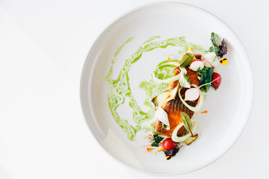 Plate of dressed salmon fillet 
