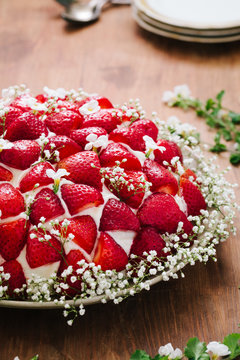 Cake decorated with strawberries and gypsophila