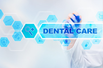 Medical doctor drawing dental care on the virtual screen.
