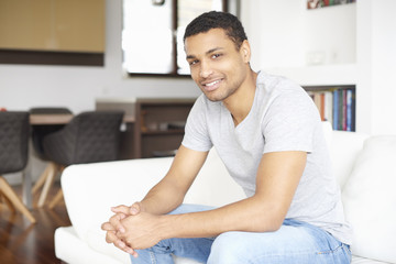Weekend at home. Shot of an African American young man relaxing on the sofa.