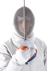 portrait of fencer in uniform holding rapier in hand on white