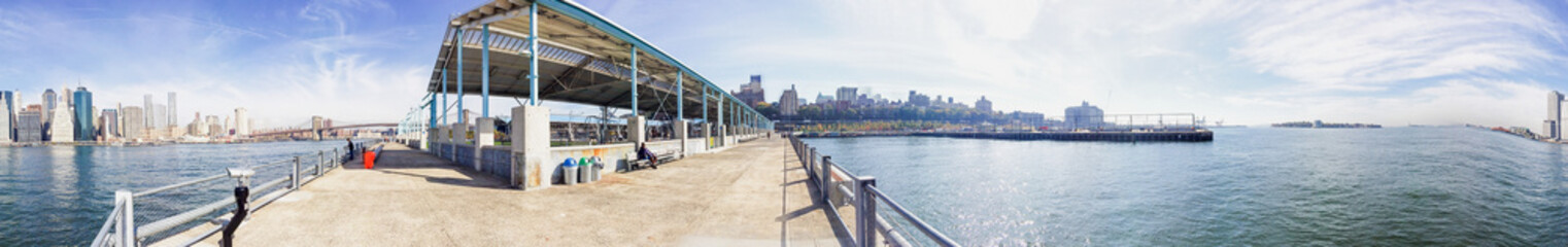 NEW YORK CITY - OCTOBER 2015: Tourists in Brooklyn Bridge Park. New York attracts 50 million tourists annually