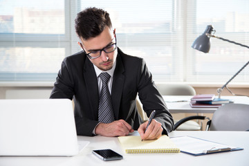 Fototapeta premium Businessman working in an office