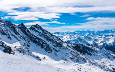 Fototapeta na wymiar French Alps with sun and clouds