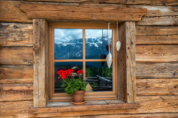 Fototapeta na wymiar Window mountain chalet