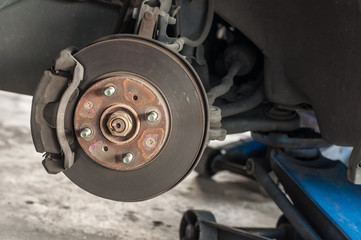 Car changing new tire lift up car by use hand jack.