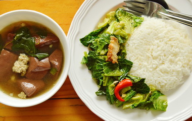 stir fried Chinese kale sprout with crispy pork and ivy gourd soup