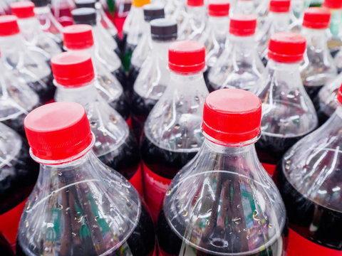 Carbonated soft drink bottles close up