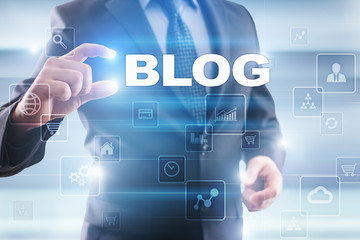 Businessman selecting blog on virtual screen.
