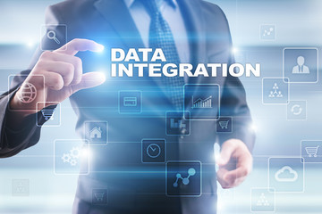 Businessman selecting data integration on virtual screen.