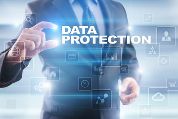Fototapeta na wymiar Businessman selecting data protection on virtual screen.