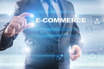 Businessman selecting e-commerce on virtual screen.