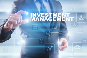 Fototapeta na wymiar Businessman selecting investment management on virtual screen.