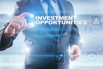 Fototapeta na wymiar Businessman selecting investment opportunities on virtual screen.