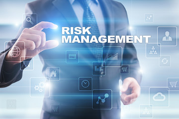 Fototapeta na wymiar Businessman selecting risk management on virtual screen.