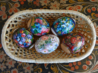 Easter eggs in straw basket 