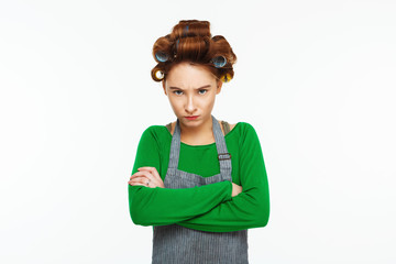 Young frustrated housewife cleaning on white