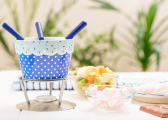 White with blue kit for making chocolate fondue.