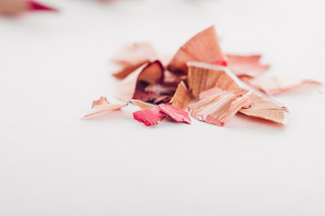 cosmetic pink pencil shavings on white background - Powered by Adobe