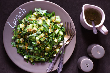 Cucumber salad with avocado kiwi and arugula
